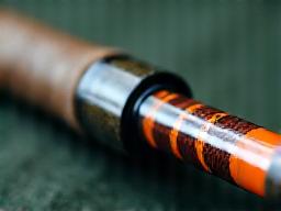 A professionally refinished fishing rod with a glossy finish